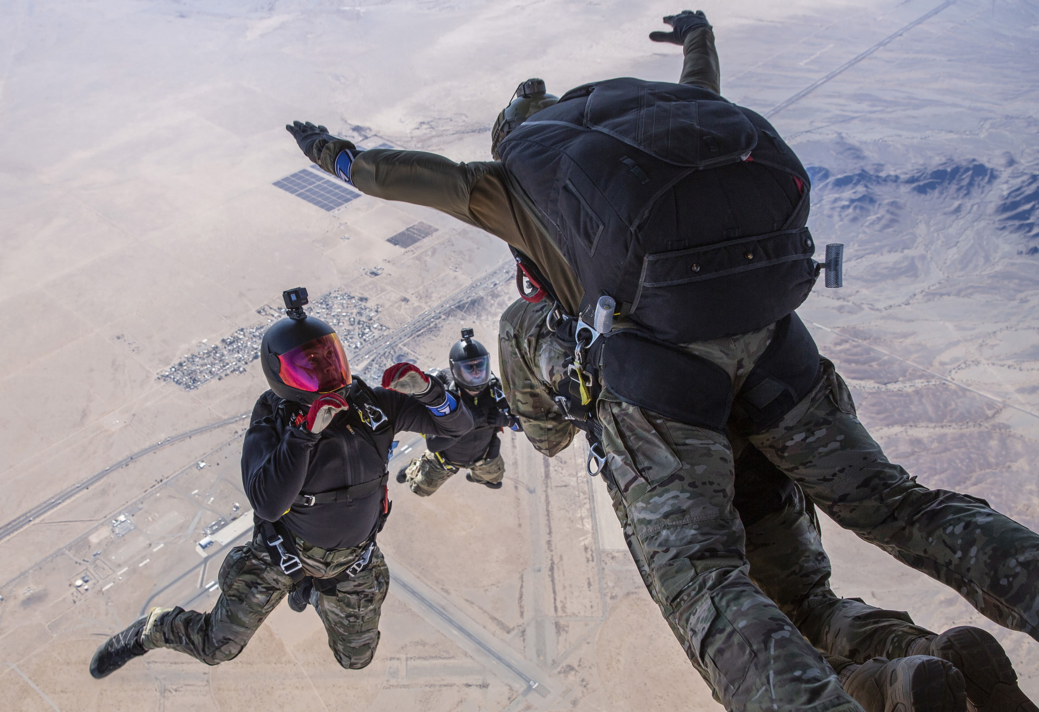Four soldiers during a skydiver.